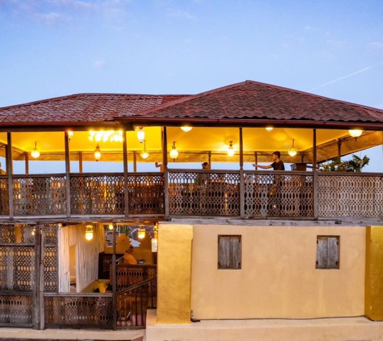 Lantern-lit rooftop pavilion of Jafferji House at dusk