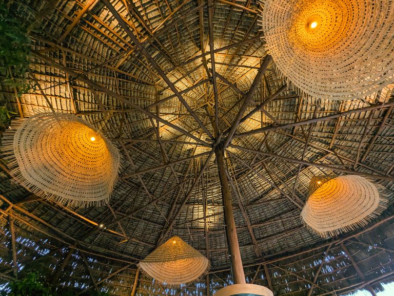Woven lampshades under the thatched roof at Yasa Boutique Hotel, Nungwi