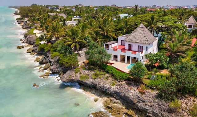 Aerial view of a clifftop villa at Essque Zalu Zanzibar above the ocean