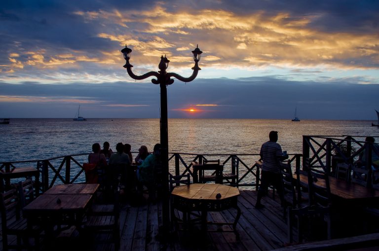 Diners on the Langi Langi sea deck watching the sunset
