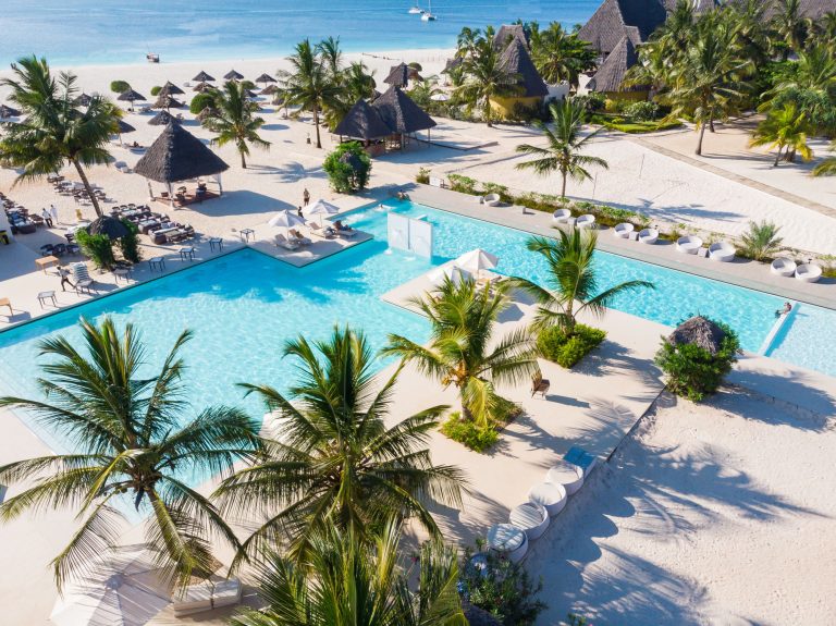 Aerial view of the wide pool and palms at Gold Zanzibar