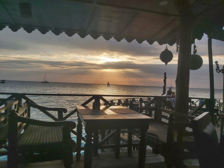Langi Langi restaurant terrace over the beach at sunset