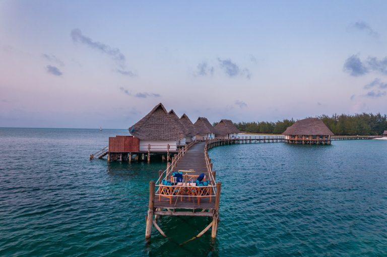Isaraya over-water villas at dusk at Konokono Beach Resort