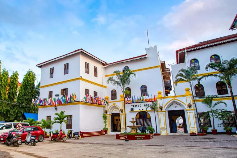 White façade and entrance of Tembo House Hotel in Shangani