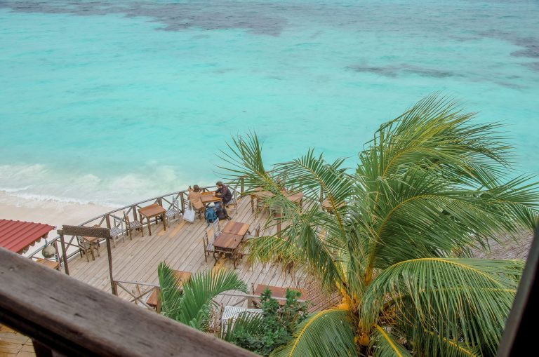 Wooden deck of Langi Langi above the turquoise sea in Nungwi