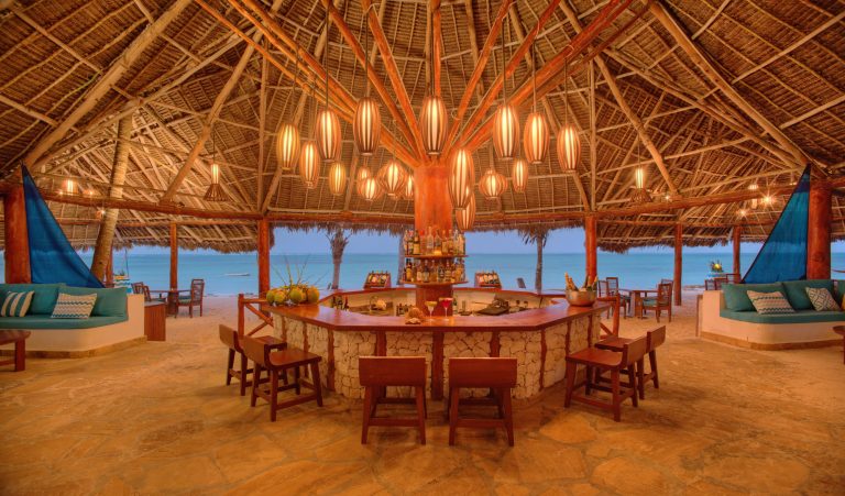 Large makuti-roofed bar with sea views at Bluebay Beach Resort