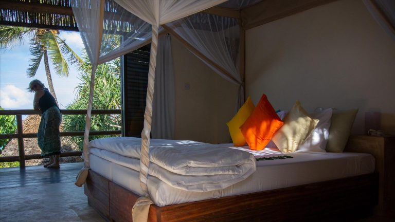 Oceanfront Pearl Suite with bed and balcony at Zanzibar Pearl