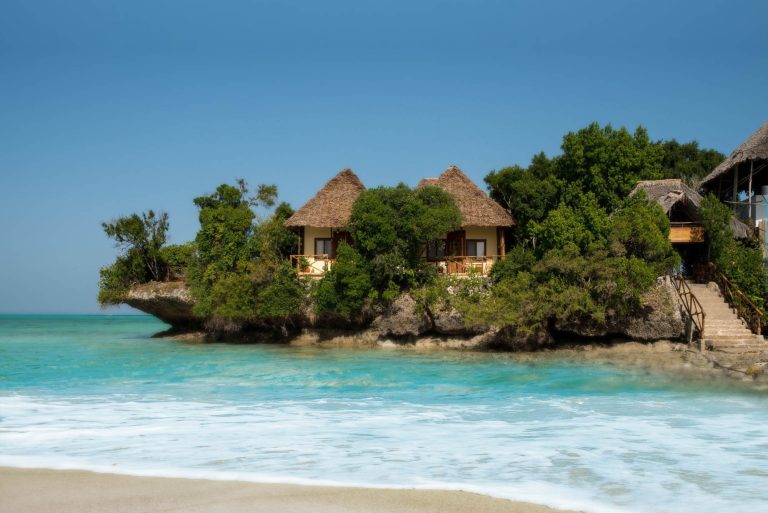 The Island Pongwe's thatched villas on a coral islet off Pongwe beach