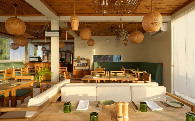 Restaurant with woven lamps and garden views at Samawa Living