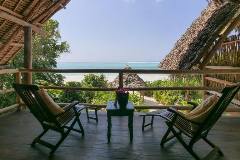 Balcony with deck chairs overlooking the sea at Zanzibar Pearl