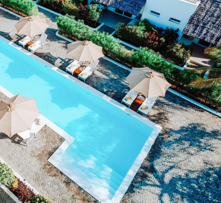 Garden pool from above with parasols at Dhow Inn