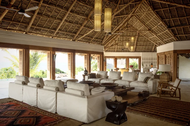Vast living room under a makuti roof at Qambani