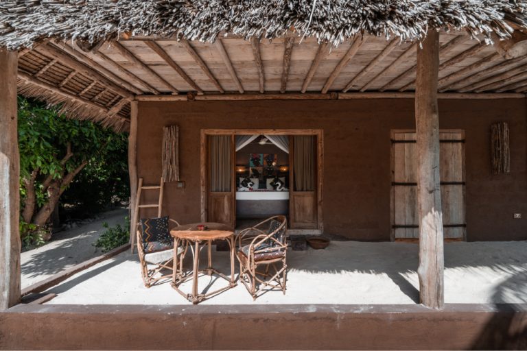 Covered veranda of a beach house at Mwezi Boutique Resort