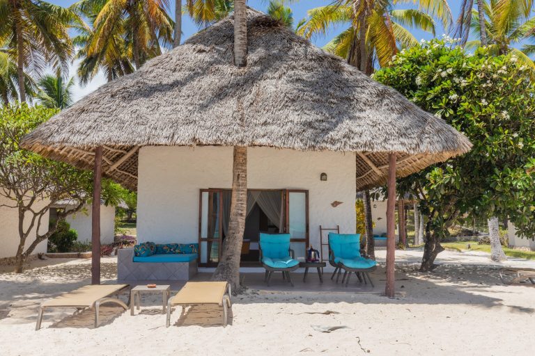 Thatched beachfront junior suite with veranda at Karafuu Beach Resort